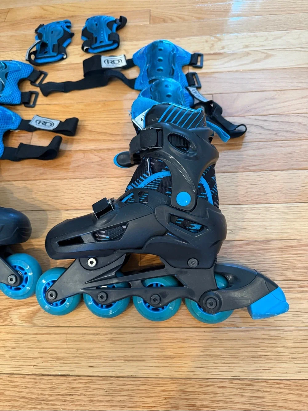 Adjustable Kids Inline Skate Set with Blue Protective Pads